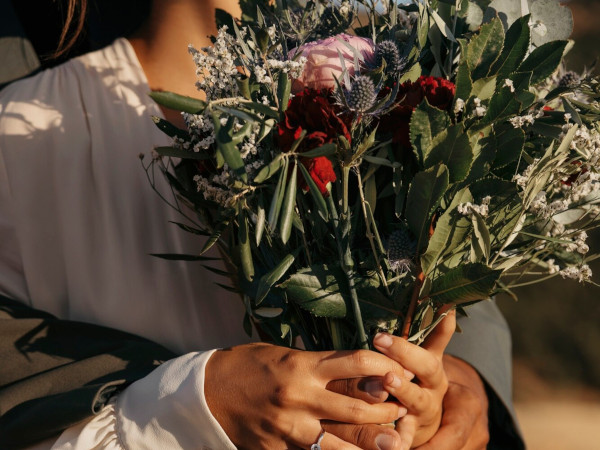 Bride holding a beautiful flower bouquet at her wedding